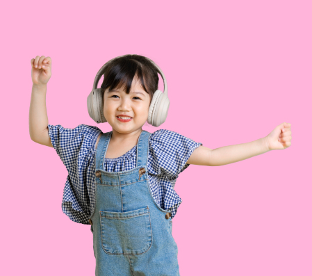 Young girl dancing with headphones on while practicing at The Music Scientist’s programme